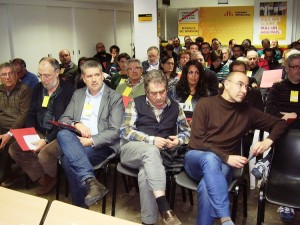 Primera fila, amb el president regional, Josep Andreu, al costat de Pau Ricomà