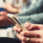 stock-footage-close-up-hands-using-mobile-phone-touchscreen